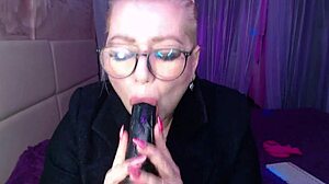 a cool busty vulgar mature whore in glasses with a ponytail on her head