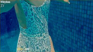 Wife Enjoys Swimming in Hotel Pool One Piece