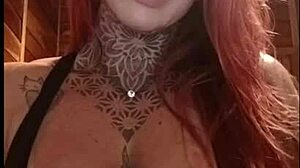 Hot redhead teases fans with her pink tits, feeling aroused