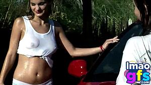 two hot brunettes naked in the carwash showing off big tits and perfect ass