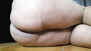 A transsexual woman explores her ass in a solo session with feet involved.