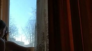 Helga Bosk Has Risky Sex by the Window with People Walking By