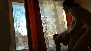 Helga Bosk Has Risky Sex by the Window with People Walking By