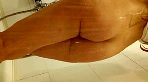 Explore a captivating redhead teen 18+ indulging in a soothing bath with indian shower elements and tattoos