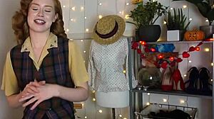 Glamorous redhead achieves intense orgasm using black vibrator