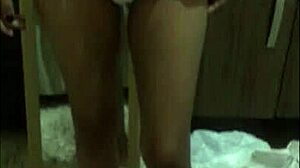 Young Latina Nurse Provides Detailed Care To Patient In Hospital Environment