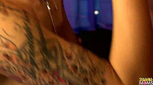 skinny tattooed milf with short blonde hair is getting hammered at a club by a big dicked guy, bent over in stockings and lingerie