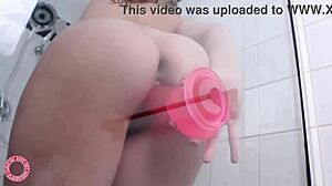 Green-eyed blonde Samantha Rone indulges in dildo play. Under the shower spray.