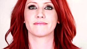 Elle Alexandra teases with seductive redhead striptease