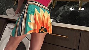 hot brunette babe in the kitchen first with panties then she takes her underwear off under her mini skirt