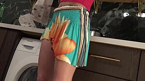 hot brunette babe in the kitchen first with panties then she takes her underwear off under her mini skirt