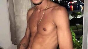 The naughty boy jerks off at the building window