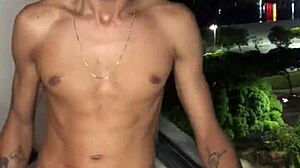 The naughty boy jerks off at the building window