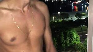 The naughty boy jerks off at the building window