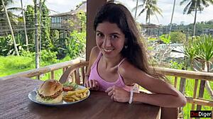 cute girl eating burger with cum on her face in public cafe - cumwalk 😋