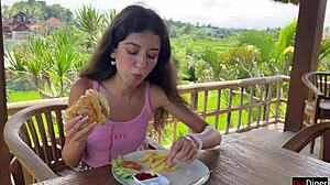 cute girl eating burger with cum on her face in public cafe - cumwalk 😋