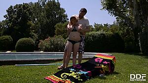 Busty redhead Lola Fauve relaxes by the pool with the pool boy