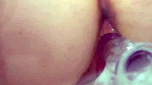 natural busty redhead closeup with clear dildo