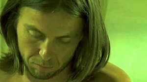 The master guides his student through intimate massage techniques