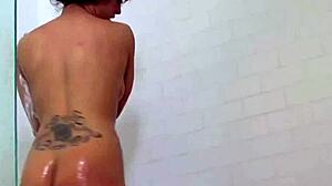 Capri, a brunette pornstar with big tits, passionately fingers her tight cunt in solo masturbation