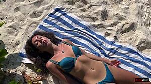 amateur girl gets pissed on by lover on public beach, shocked reaction