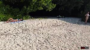amateur girl gets pissed on by lover on public beach, shocked reaction