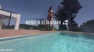 Underwater, two lesbians strap on and fuck passionately