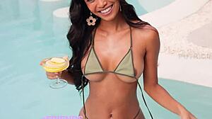 beautiful model putri cinta teasingly spreads pussy close-up by the pool