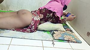 Arab wife feels intense pleasure in viral hijab doggystyle fuck at boarding house.