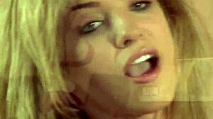 The hot blonde teen whore masturbates on the table top