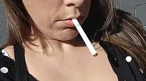 kelly kendricks smokes cigarettes in the sun with lots of cleavage