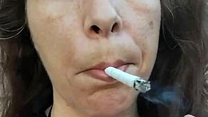 kelly kendricks smokes cigarettes in the sun with lots of cleavage