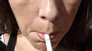 kelly kendricks smokes cigarettes in the sun with lots of cleavage