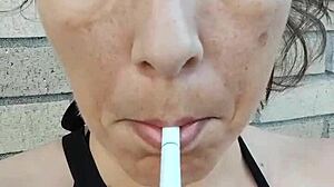 kelly kendricks smokes cigarettes in the sun with lots of cleavage