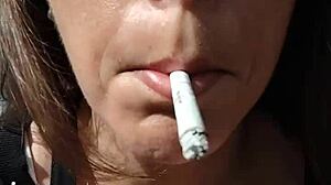 kelly kendricks smokes cigarettes in the sun with lots of cleavage