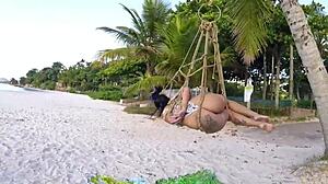 Brunette Bound in Shibari on Coconut Tree for Outdoor Voyeur Thrill