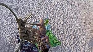 Brunette Bound in Shibari on Coconut Tree for Outdoor Voyeur Thrill