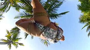 Brunette Bound in Shibari on Coconut Tree for Outdoor Voyeur Thrill