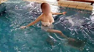 Cute asian student does pool exercises