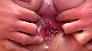 Squirting pee after orgasm from rubbing pierced clit.