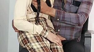 Schoolgirl receives guidance from teacher in classroom setting