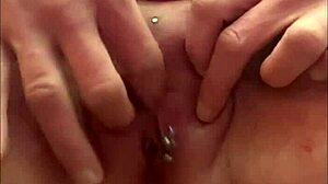 Squirting pee after orgasm from rubbing pierced clit.