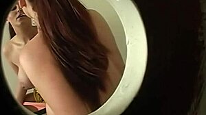 Gloryhole big tits sucking cock through hole