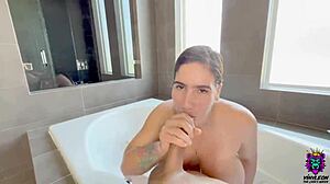 Busty latina with tattoo sucks and fucks in shower cum on face