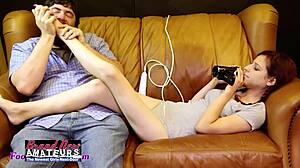 Katie walls with hairy pussy foot jobs him as he masturbates her.