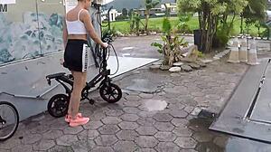 Two beauties cycle without panties in rain
