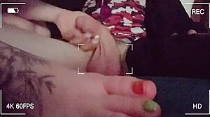 Stroking hubby's friend's big cock with my little feet