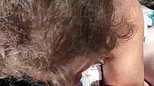 Outdoor blowjob in public voyeur setting.