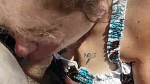 Outdoor blowjob in public voyeur setting.