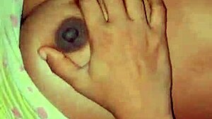 The deshi bhabi was playing with her big boobs at home